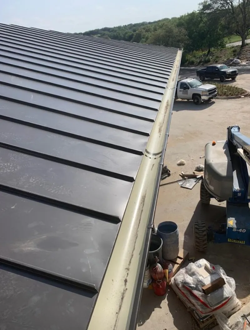 Standing seam panel and gutter detail on a metal roofing jobsite in Hacienda Heights
